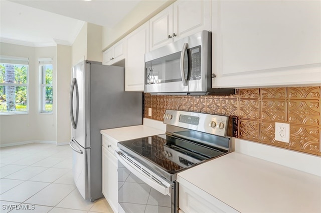 20010 Barletta Ln Unit 612, Estero, FL 33928 - kitchen with appliances with stainless steel finishes, ornamental molding, backsplash, light countertops, and white cabinets