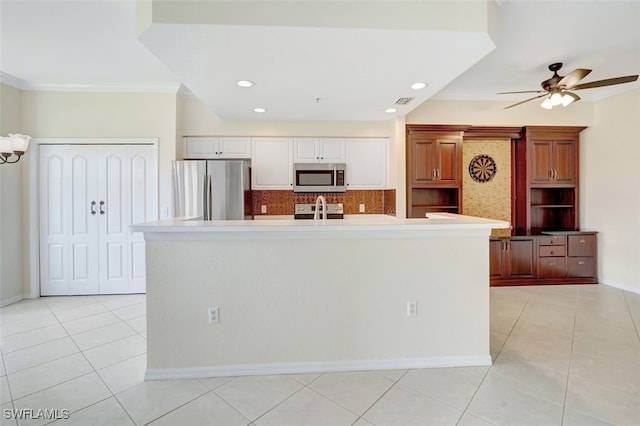 20010 Barletta Ln Unit 612, Estero, FL 33928 - kitchen with stainless steel appliances, backsplash, light tile patterned floors, ornamental molding, and ceiling fan
