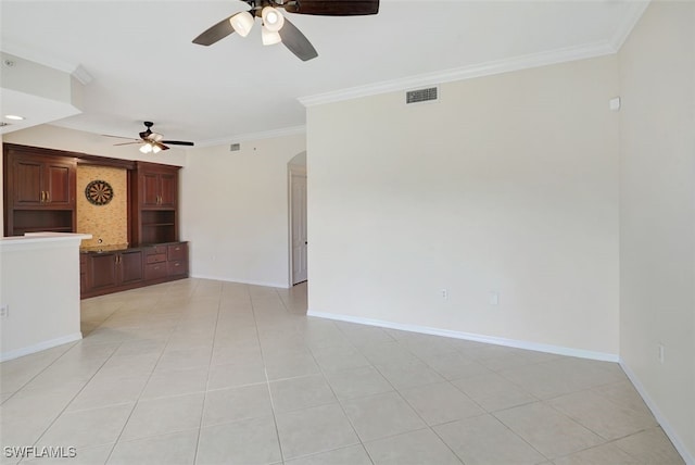 20010 Barletta Ln Unit 612, Estero, FL 33928 - unfurnished living room featuring ceiling fan, ornamental molding, arched walkways, and light tile patterned floors