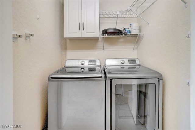 20010 Barletta Ln Unit 612, Estero, FL 33928 - washroom with cabinet space and washing machine and clothes dryer
