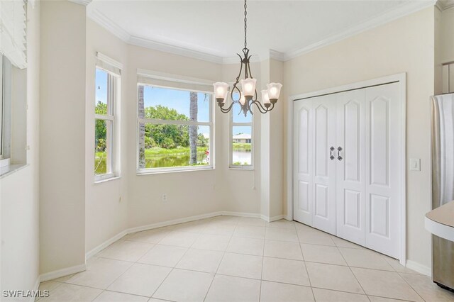 20010 Barletta Ln Unit 612, Estero, FL 33928 - unfurnished dining area with a chandelier, ornamental molding, and light tile patterned floors