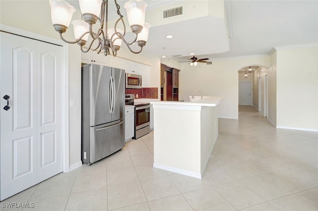 20010 Barletta Ln Unit 612, Estero, FL 33928 - kitchen with appliances with stainless steel finishes, a chandelier, arched walkways, tasteful backsplash, and a ceiling fan