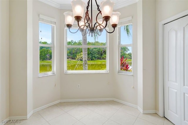 20010 Barletta Ln Unit 612, Estero, FL 33928 - unfurnished dining area featuring a chandelier, crown molding, and light tile patterned floors