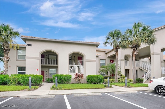 20010 Barletta Ln Unit 612, Estero, FL 33928 - view of building exterior featuring uncovered parking