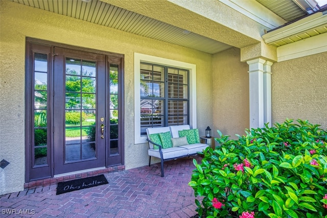 13461 Sabal Pointe Dr, Fort Myers, FL 33905 - property entrance with stucco siding and french doors