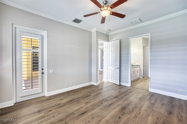 13461 Sabal Pointe Dr, Fort Myers, FL 33905 - unfurnished bedroom featuring crown molding, wood finished floors, connected bathroom, and a ceiling fan