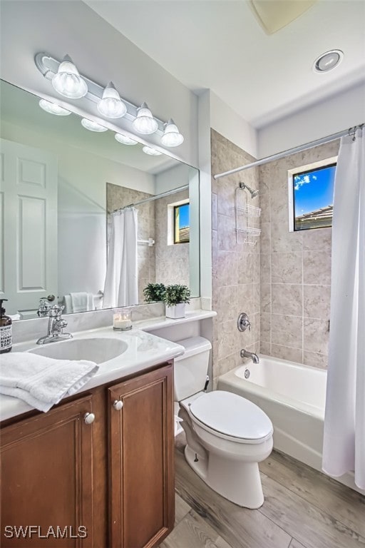 13461 Sabal Pointe Dr, Fort Myers, FL 33905 - bathroom featuring shower / bath combo with shower curtain, vanity, and wood finished floors
