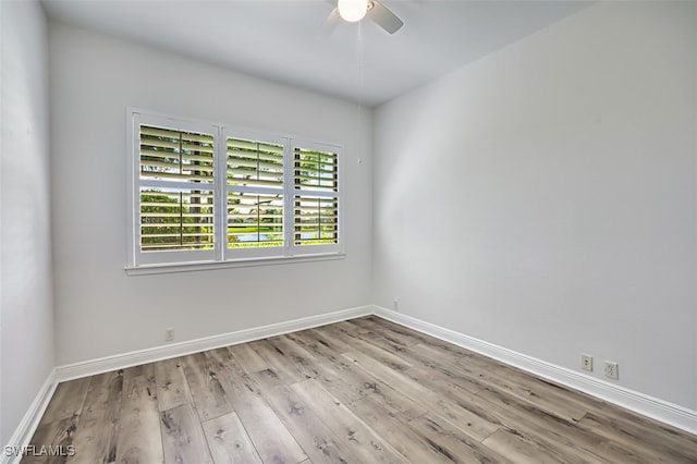 13461 Sabal Pointe Dr, Fort Myers, FL 33905 - spare room with a ceiling fan and wood finished floors