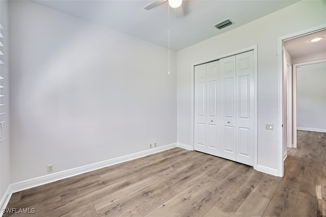 13461 Sabal Pointe Dr, Fort Myers, FL 33905 - unfurnished bedroom featuring wood finished floors, a closet, and a ceiling fan
