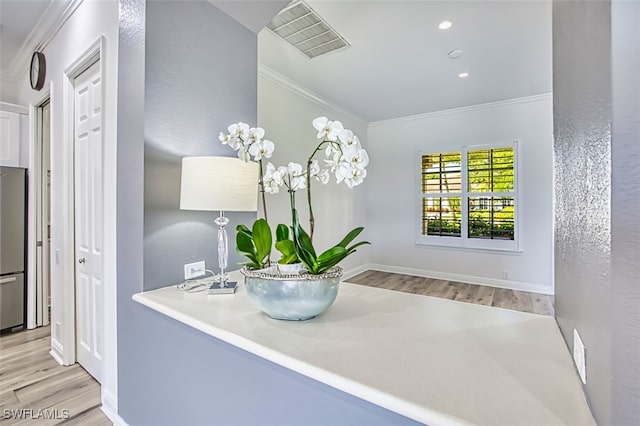 13461 Sabal Pointe Dr, Fort Myers, FL 33905 - detailed view of ornamental molding, wood finished floors, freestanding refrigerator, and recessed lighting