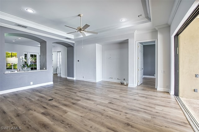 13461 Sabal Pointe Dr, Fort Myers, FL 33905 - unfurnished living room with a tray ceiling, ceiling fan, crown molding, light wood-style flooring, and recessed lighting