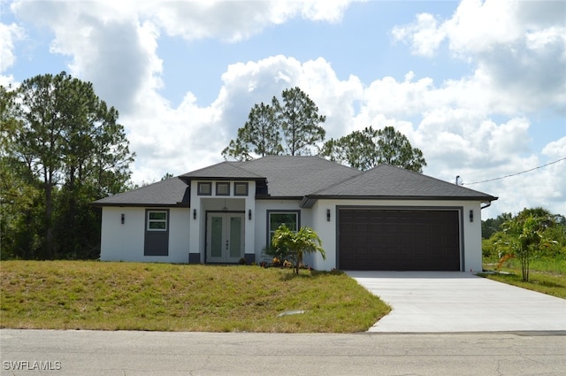 1402 Henry Ave, Lehigh Acres, FL 33972 - prairie-style home featuring french doors, an attached garage, driveway, stucco siding, and a front yard