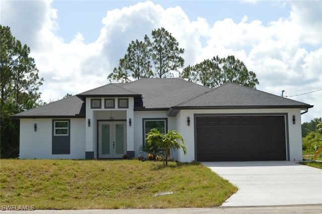1402 Henry Ave, Lehigh Acres, FL 33972 - view of front of property featuring french doors, stucco siding, an attached garage, driveway, and a front lawn