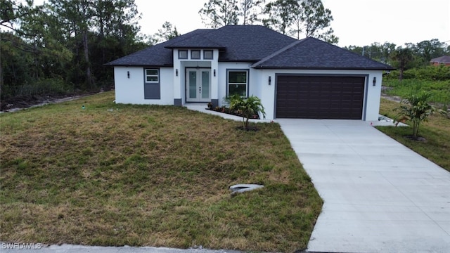 1402 Henry Ave, Lehigh Acres, FL 33972 - view of front of home with french doors, roof with shingles, an attached garage, stucco siding, and a front yard