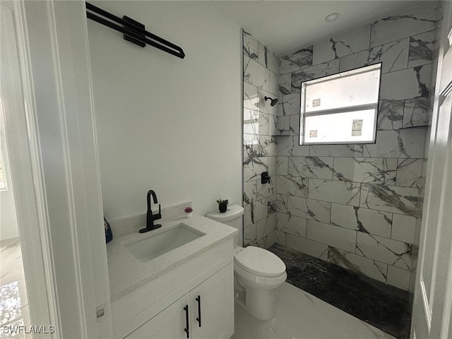 1402 Henry Ave, Lehigh Acres, FL 33972 - bathroom with tiled shower, vanity, and marble finish floors