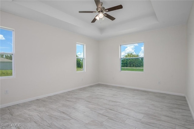 311 Rand Ave, Lehigh Acres, FL 33974 - unfurnished room featuring a tray ceiling and ceiling fan