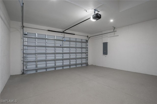 311 Rand Ave, Lehigh Acres, FL 33974 - garage with a garage door opener and electric panel