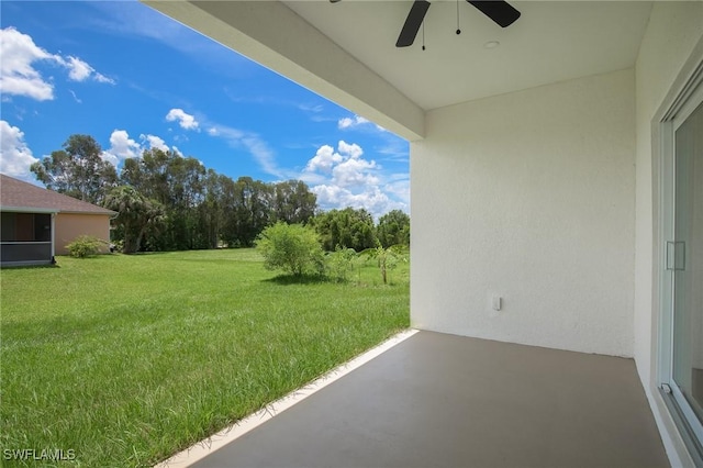 311 Rand Ave, Lehigh Acres, FL 33974 - view of green lawn featuring a ceiling fan and a patio