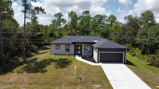 4204 E 24th St, Alva, FL 33920 - view of front of house featuring a garage, concrete driveway, a front lawn, and roof with shingles