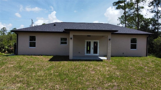 4204 E 24th St, Alva, FL 33920 - rear view of house featuring french doors, stucco siding, a yard, and a patio area