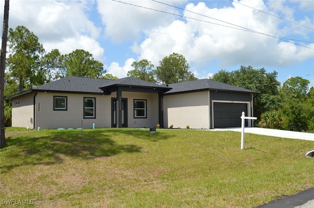 4204 E 24th St, Alva, FL 33920 - prairie-style home with an attached garage, a front yard, driveway, and roof with shingles