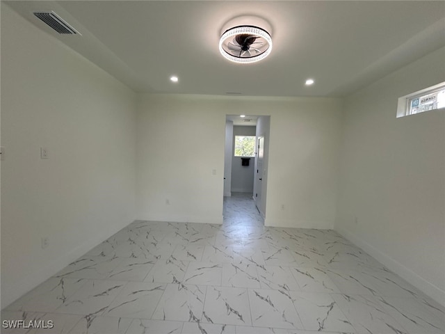 4204 E 24th St, Alva, FL 33920 - unfurnished room featuring recessed lighting, marble look tile flooring, and healthy amount of natural light