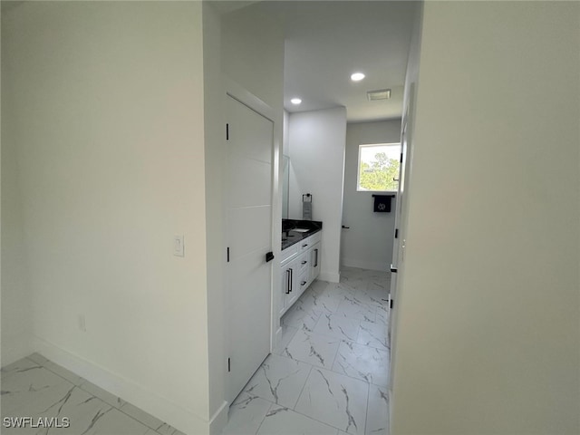 4204 E 24th St, Alva, FL 33920 - bathroom with marble finish floors, recessed lighting, and vanity