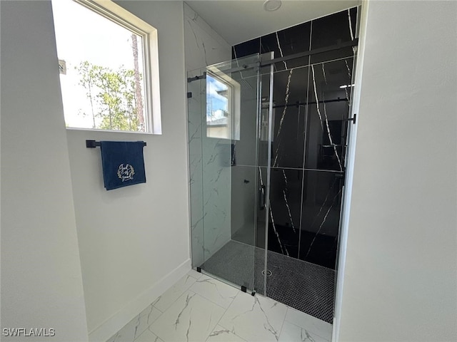4204 E 24th St, Alva, FL 33920 - bathroom featuring a marble finish shower and marble look tile flooring