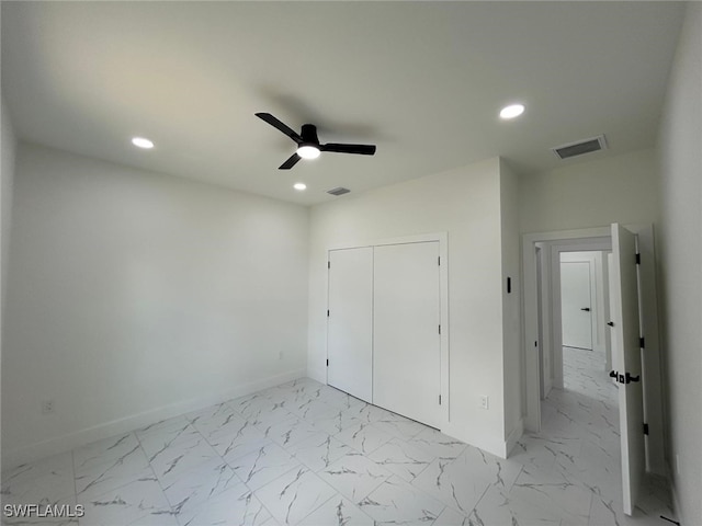 4204 E 24th St, Alva, FL 33920 - unfurnished bedroom featuring recessed lighting, light marble finish floors, a closet, and a ceiling fan