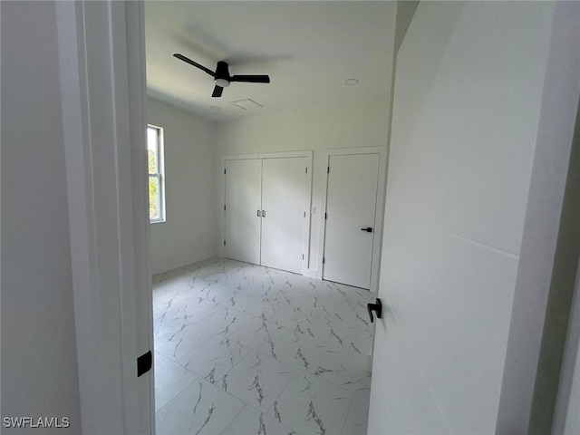 4204 E 24th St, Alva, FL 33920 - unfurnished bedroom featuring marble look tiles and a ceiling fan