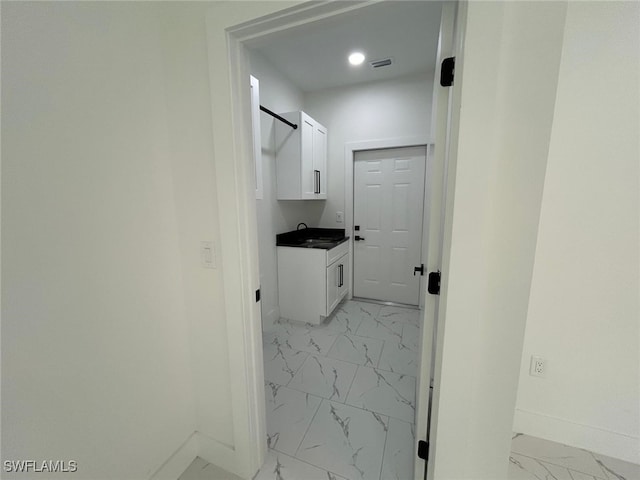 4204 E 24th St, Alva, FL 33920 - laundry area featuring light marble finish floors and recessed lighting