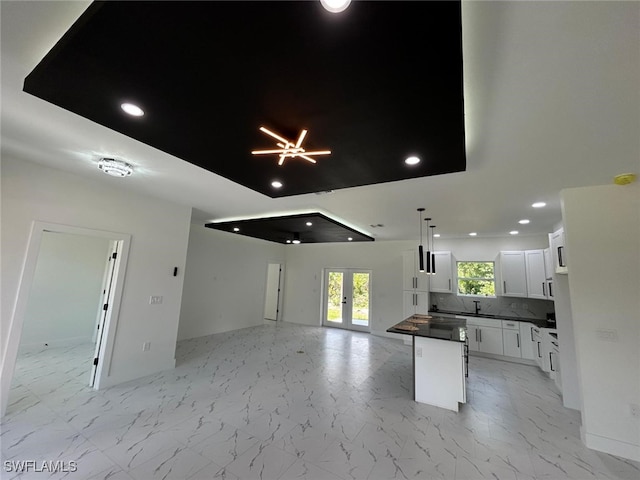 4204 E 24th St, Alva, FL 33920 - kitchen with open floor plan, dark countertops, recessed lighting, backsplash, and a center island