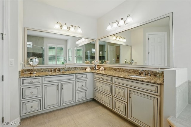 23484 Sanabria Loop, Bonita Springs, FL 34135 - bathroom featuring double vanity and tiled shower