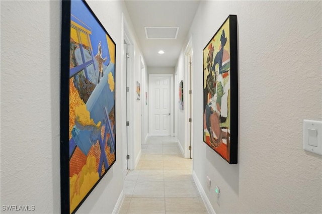 23484 Sanabria Loop, Bonita Springs, FL 34135 - hallway featuring light tile patterned floors, a textured wall, and recessed lighting