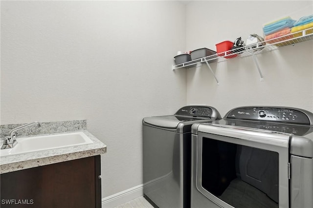 23484 Sanabria Loop, Bonita Springs, FL 34135 - laundry area featuring washing machine and dryer and cabinet space