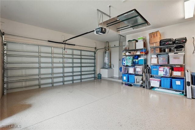 23484 Sanabria Loop, Bonita Springs, FL 34135 - garage featuring a garage door opener and gas water heater