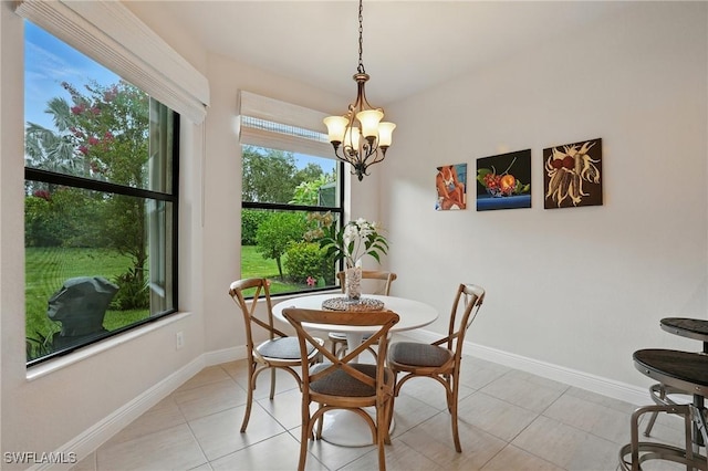 23484 Sanabria Loop, Bonita Springs, FL 34135 - dining room with a chandelier and light tile patterned floors