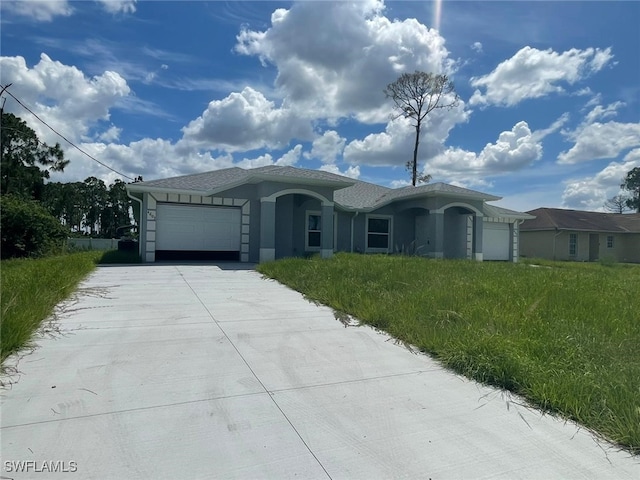 4605/4607 30th St SW, Lehigh Acres, FL 33973 - ranch-style house with a garage, driveway, and stucco siding