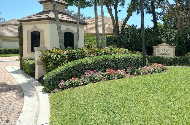 922 Turtle Ct Unit 21-21, Naples, FL 34108 - community sign featuring a lawn