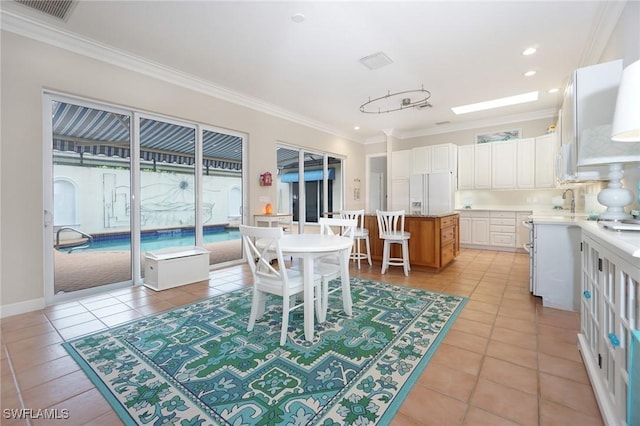 922 Turtle Ct Unit 21-21, Naples, FL 34108 - dining space featuring crown molding, light tile patterned floors, and recessed lighting