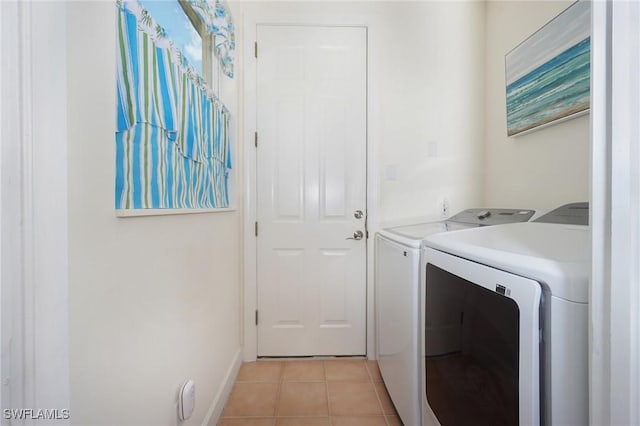 922 Turtle Ct Unit 21-21, Naples, FL 34108 - washroom with separate washer and dryer and light tile patterned floors