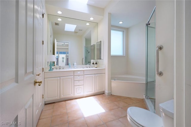 922 Turtle Ct Unit 21-21, Naples, FL 34108 - bathroom with double vanity, a bath, a shower stall, recessed lighting, and tile patterned flooring
