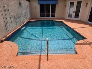 922 Turtle Ct Unit 21-21, Naples, FL 34108 - swimming pool featuring french doors and a patio area