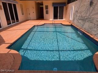 922 Turtle Ct Unit 21-21, Naples, FL 34108 - outdoor pool with a patio area