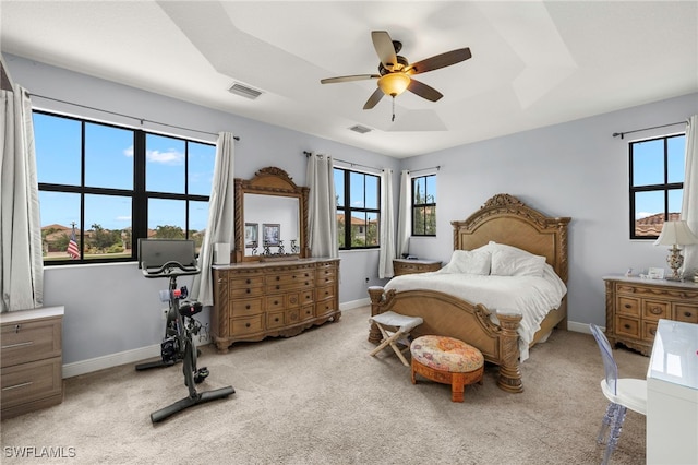 5158 Roma St, Ave Maria, FL 34142 - bedroom with multiple windows, light colored carpet, and ceiling fan