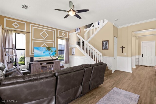 5158 Roma St, Ave Maria, FL 34142 - living area with a decorative wall, stairs, ornamental molding, ceiling fan, and wood finished floors