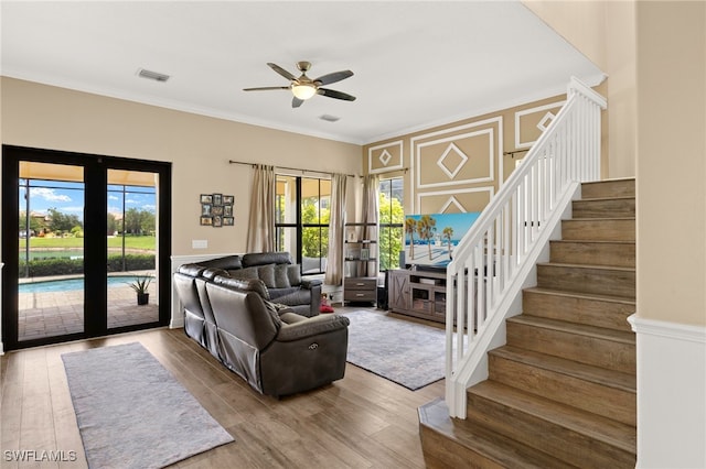 5158 Roma St, Ave Maria, FL 34142 - living area featuring stairs, ceiling fan, ornamental molding, plenty of natural light, and wood finished floors