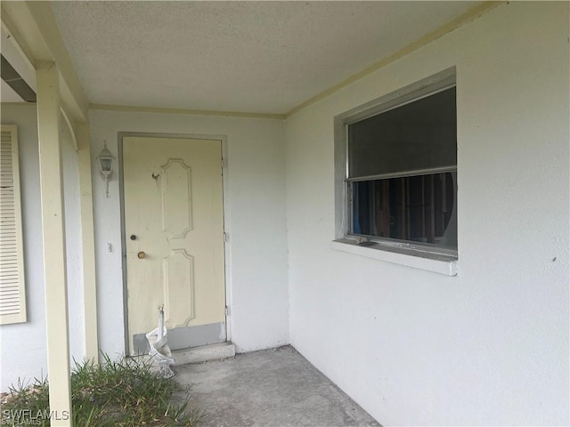 3 Palmview Blvd, Fort Myers Beach, FL 33931 - view of exterior entry featuring stucco siding