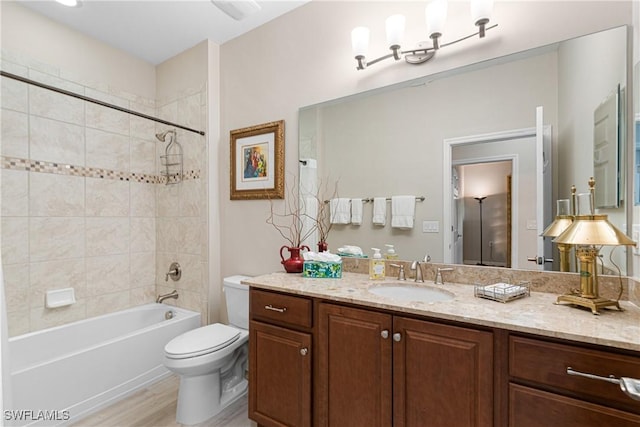 10736 Cetrella Dr, Fort Myers, FL 33913 - bathroom with vanity, shower / tub combination, and wood finished floors
