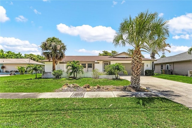 3823 Palm Tree Blvd, Cape Coral, FL 33904 - ranch-style home with driveway, a garage, a front lawn, and stucco siding